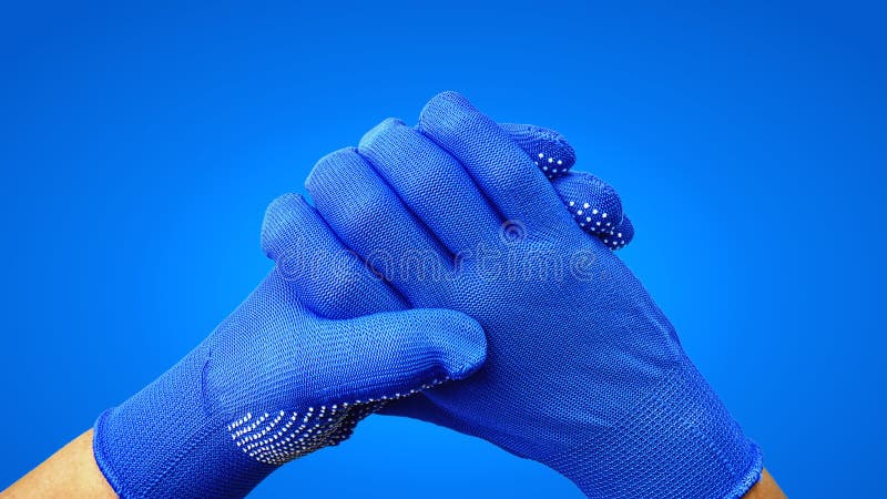 Close-up Hands Gesture in Blue Gloves Isolated on Blue Background stock images Close-up Hands Gesture in Blue Gloves Isolated on Blue Background stock images