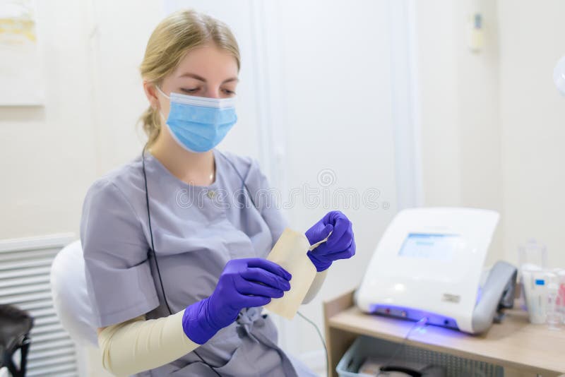 Closeup in the Hands of a Master Electrolysis of a Disposable Rod for
