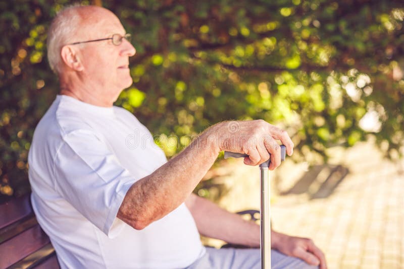 Close up hands of old man with his walking stick royalty free stock photography Close up hands of old man with his walking stick royalty free stock photography