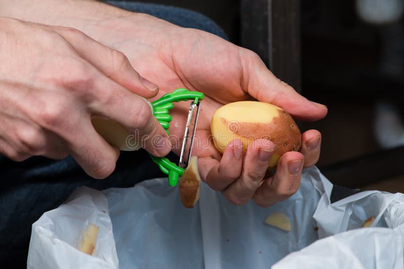 Closeup Hands Peeling Potatoes with a Knife Stock Image Image of