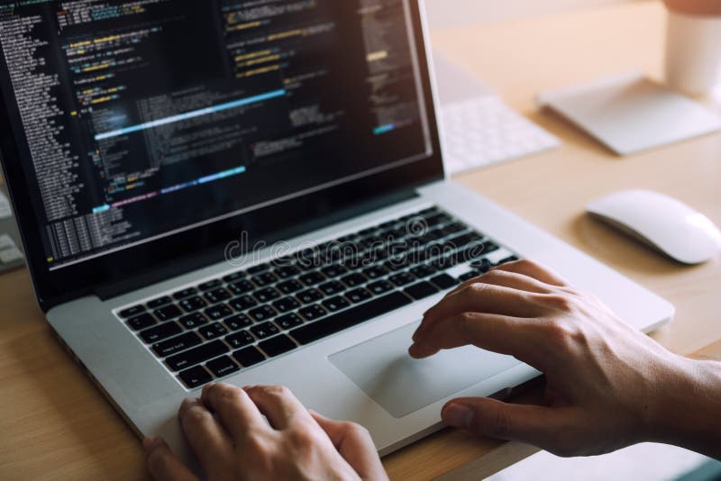 Close up hands of the software developers are sitting serious work analyzing data on the computer screen royalty free stock images