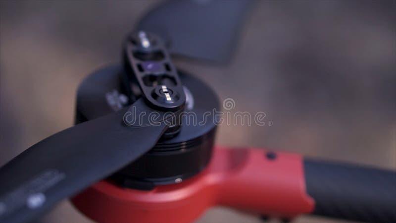 Close up for hands spreading black blades of a quadrocopter, the concept of learning techniques. Clip. Preparation for royalty free stock image Close up for hands spreading black blades of a quadrocopter, the concept of learning techniques. Clip. Preparation for royalty free stock image