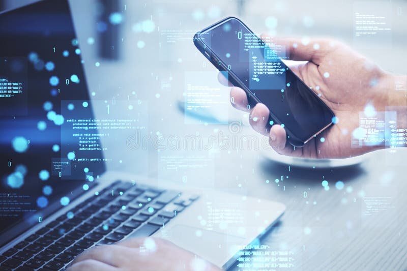 Close up of hands using laptop and cellphone with creative binary coding hologram on blurry background. Software programming code stock photos