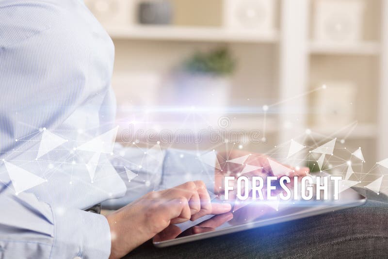 Close up hands using tablet with FORESIGHT inscription, modern business technology concept