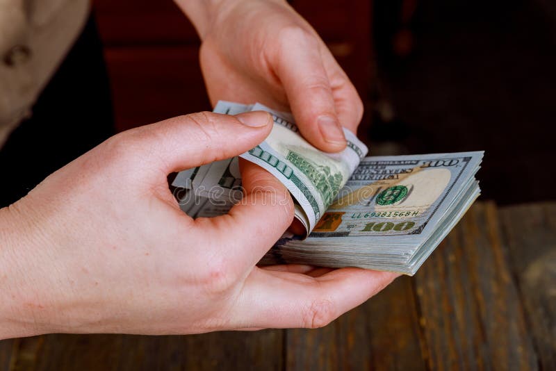 close up hands of woman counting US Dollar bills royalty free stock images close up hands of woman counting US Dollar bills royalty free stock images