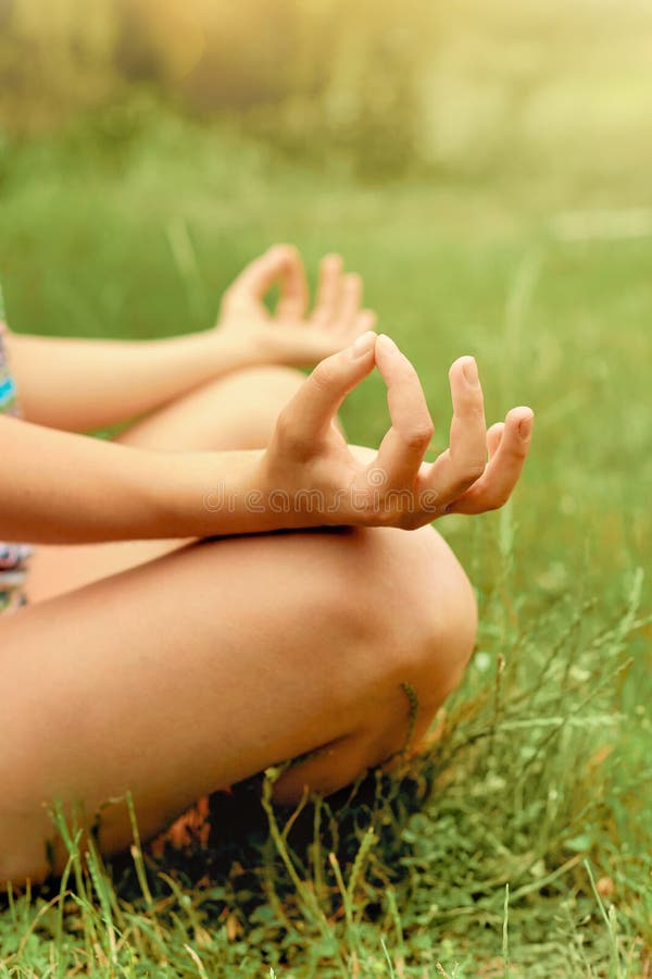 Close up hands. Woman do yoga outdoor. Woman exercising vital and meditation for fitness lifestyle club at the outdoors nature bac royalty free stock images Close up hands. Woman do yoga outdoor. Woman exercising vital and meditation for fitness lifestyle club at the outdoors nature bac royalty free stock images