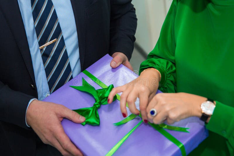Close up hands woman and man open gift box at Christmas party, holiday celebration. Happy New year royalty free stock images Close up hands woman and man open gift box at Christmas party, holiday celebration. Happy New year royalty free stock images