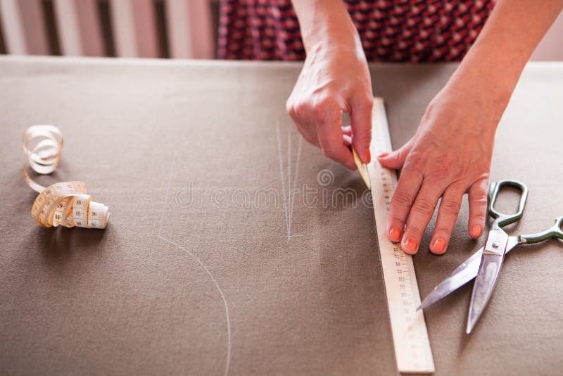 Close Up. Hands Woman Tailor Working Cutting a Roll of Fabric on Stock ...