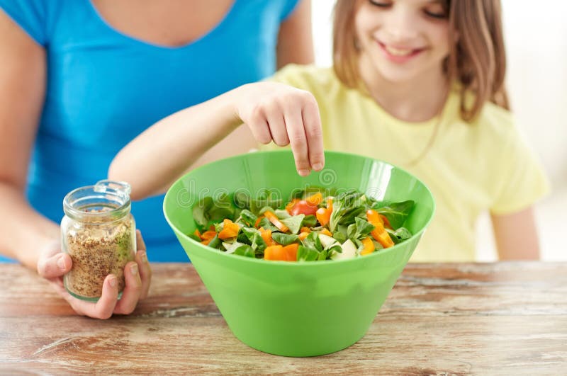 Close up of happy family cooking salad in kitchen royalty free stock photos Close up of happy family cooking salad in kitchen royalty free stock photos