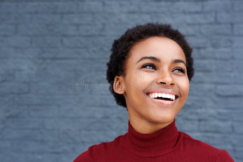 Close up happy young black woman laughing