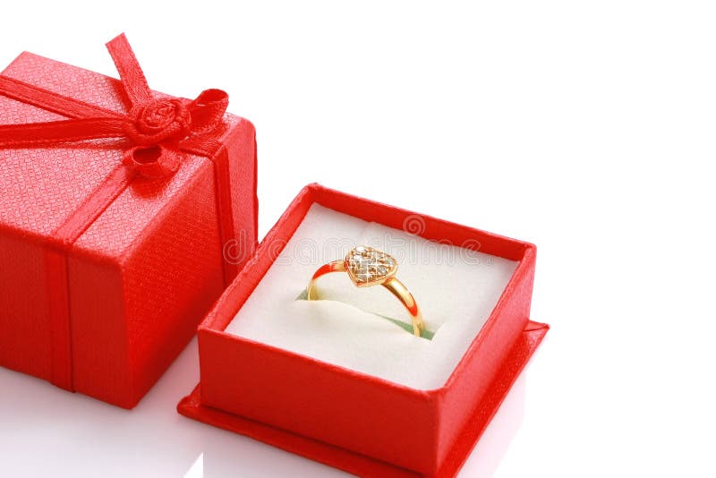 Close up heart shaped ring in red gift box