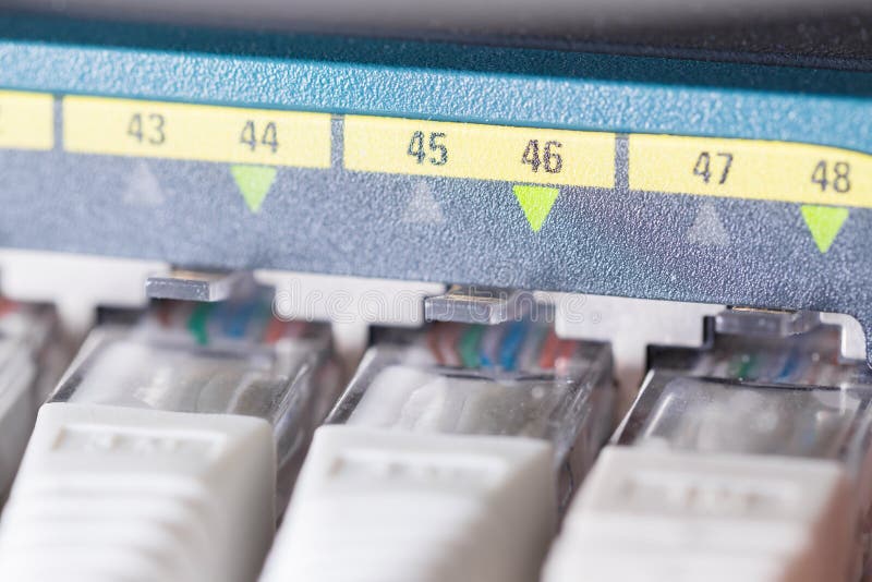 Close-up of high speed network switch and cables in datacenter. Local Area Network.