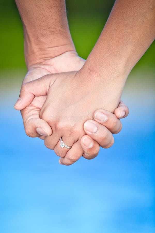 Closeup Holding Hands stock photo. Image of girl, male 27857166