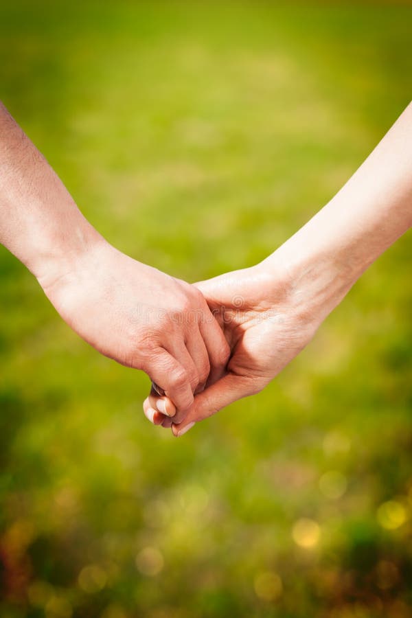 Close-up Holding Hands stock image