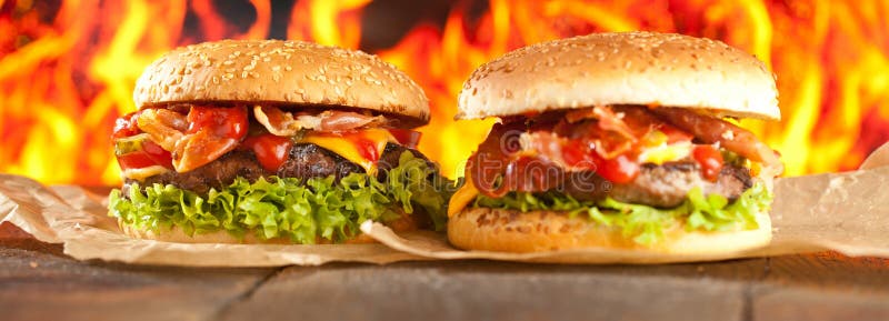 Close-up of home made burgers with fire flames