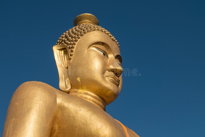 Close-up,The huge golden Buddha at khao kiaw temple in ratchaburi Thailand. stock photo Close-up,The huge golden Buddha at khao kiaw temple in ratchaburi Thailand. stock photo
