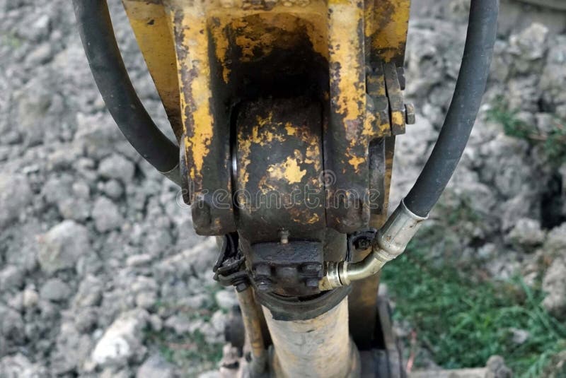 Close Up Hydraulic Hose Cable Connected with a Hydraulic Cylinder for Backhoe Stock Photo