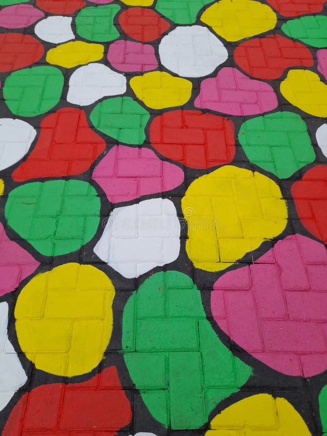 Close-up image of colorfully painted adobe floors with a circular pattern royalty free stock photos