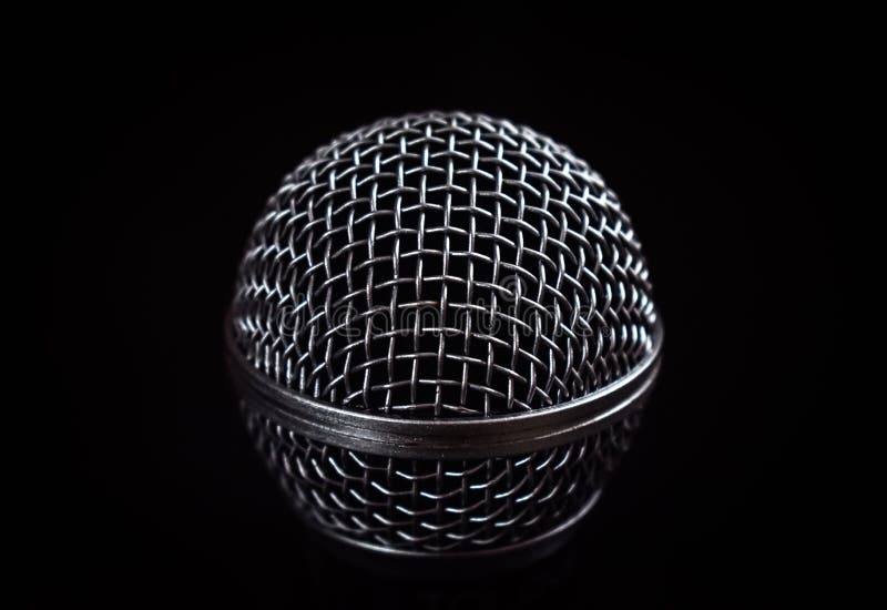 Close up image of Dynamic microphone isolated on black background