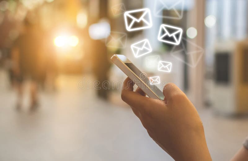 Close-up image hand using smartphone with icon envelope email. Contact us customer service or e-mail marketing concept stock photo
