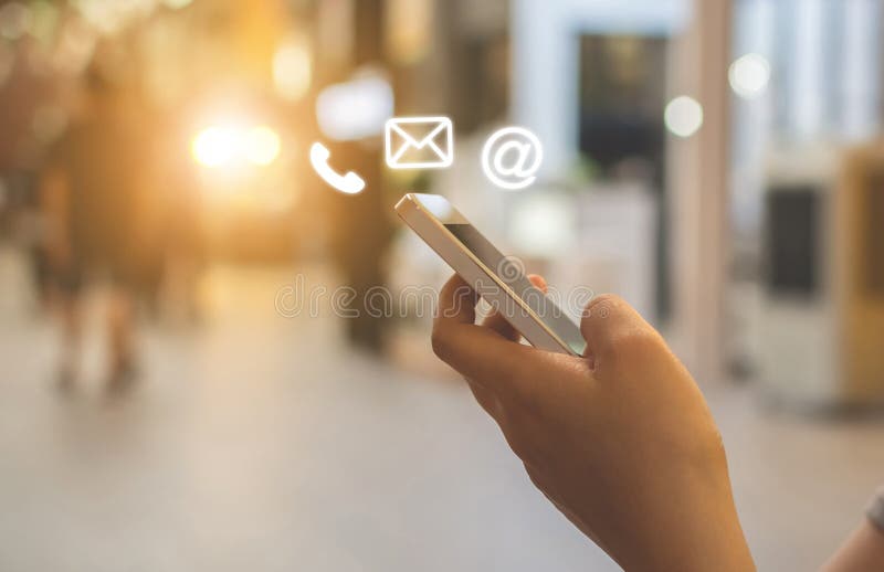 Close up image hand using smartphone with icon telephone email mobile phone and address royalty free stock photos