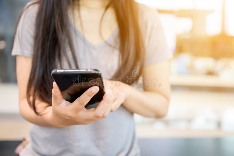 Close up image hand of woman using her mobile smartphone stock photos