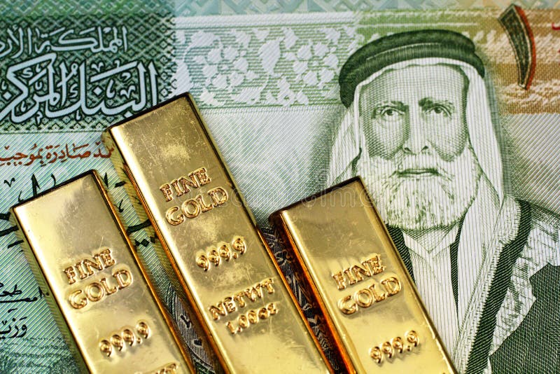A close up image of a Jordanian dinar with small gold bars stock photo A close up image of a Jordanian dinar with small gold bars stock photo
