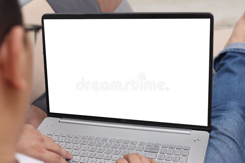 Close up image of laptop mock up, computer monitor with white screen template, man typing on laptop royalty free stock images.
