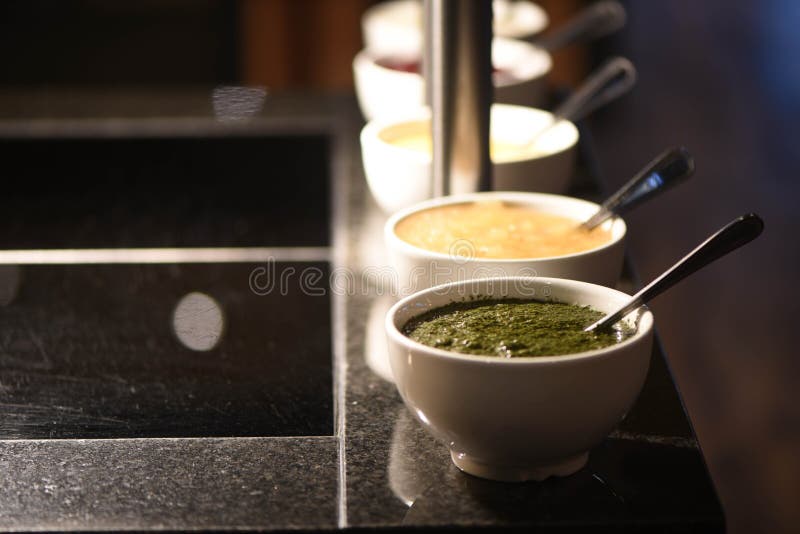 Close up food photography of a line of sauces in bowls as side dishes for roast dinners with focus on mint sauce royalty free stock images Close up food photography of a line of sauces in bowls as side dishes for roast dinners with focus on mint sauce royalty free stock images