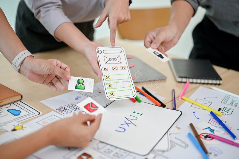 Close-up image of a mobile application developer team is in the meeting stock photography