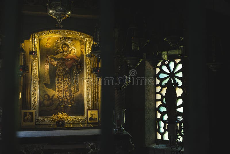 Close-up of an image that represents Mary and the child Jesus, a stained glass window is