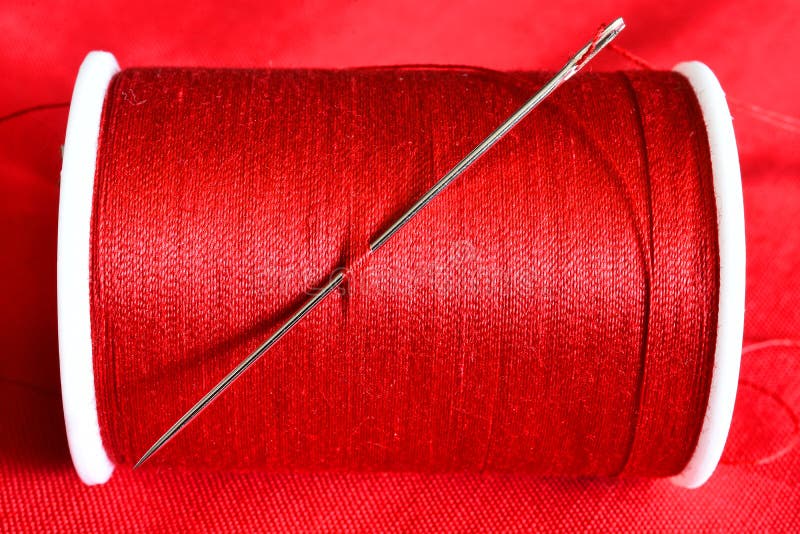 Red Thread And Sewing Needle Stock Photo - Image of white, design ...