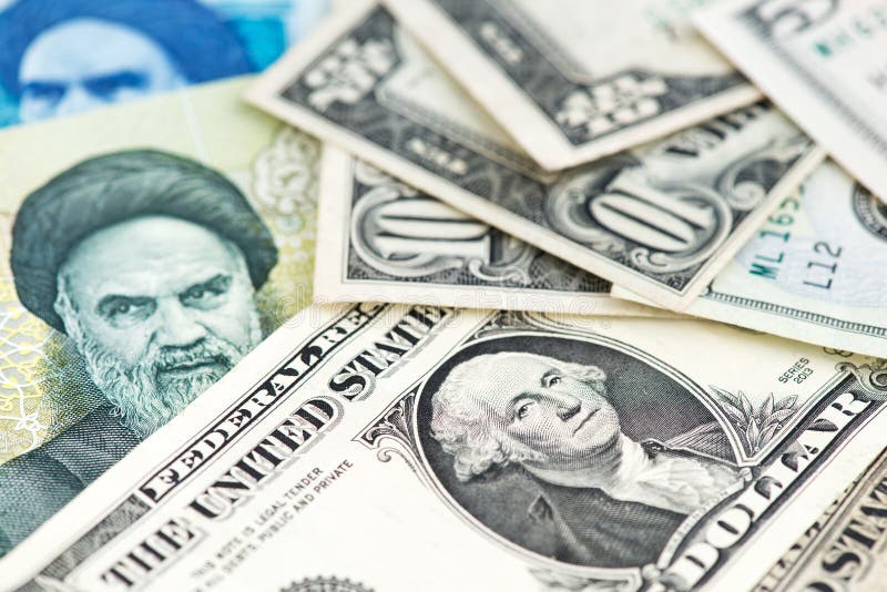 Close Up Image of US Dollar with Iranian Rial Banknotes. USA Iran Stock