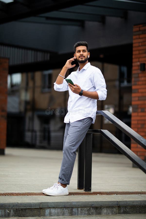 Close Up of Indian Man Speak To Phone by Wearing Wireless Earbuds while ...