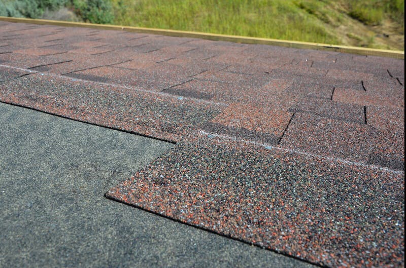 A Closeup Of Asphalt Shingled Roof Corner, Roof Intersection With Roof