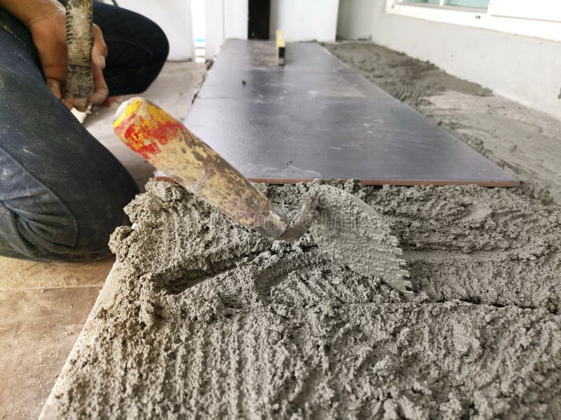 Close-up Installing tiles floor in construction work stock images Close-up Installing tiles floor in construction work stock images