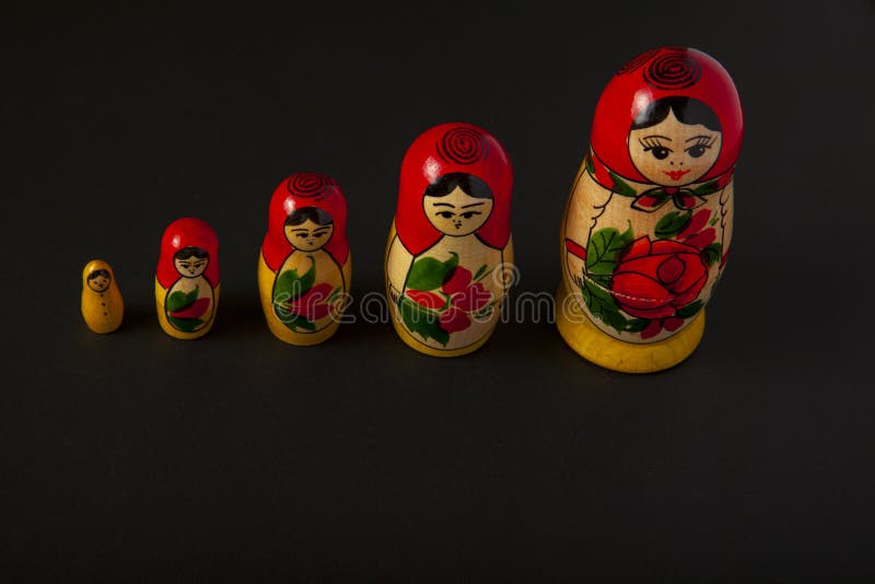 A close up isolated image of a set of handmade Russian Matrushka dolls stock photo