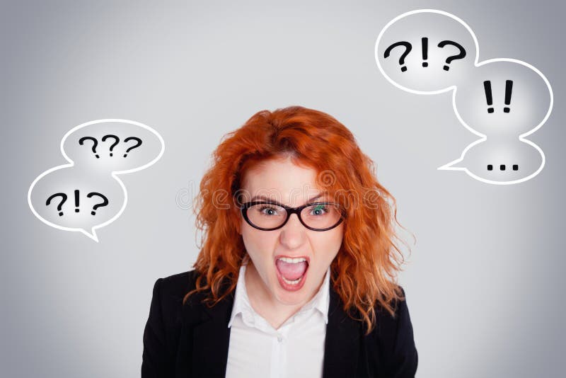 Close up isolated portrait of young annoyed angry woman. Negative human emotions face expressions. Isolated portrait on a gray background with question marks and exclamation marks.