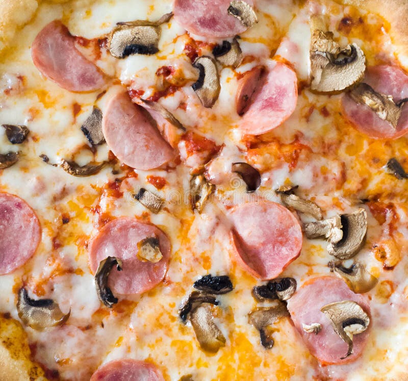Close Up of Juicy Pizza with Ham, Mushrooms and Cheese Stock Image