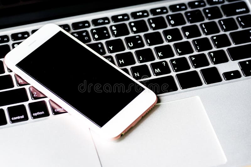 Close up of a keyboard computer with phone and tablet background stock photos Close up of a keyboard computer with phone and tablet background stock photos