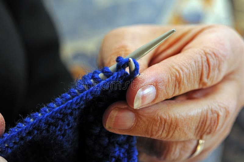 Close up of knitting wool and needles creating stocking stitch. Close up of knitting wool and needles creating stocking stitch.