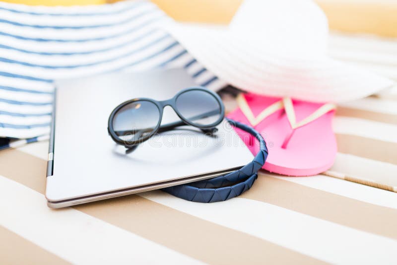 Close up of laptop on beach