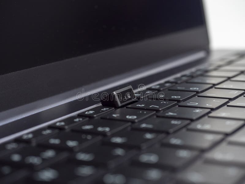 Close-up of the laptop camera built into the keyboard. Modern unusual solutions in laptops. Selective focus.