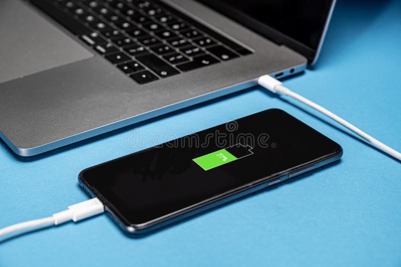 Laptop charging stock photo. Image of plugged, charge, electronic 387452
