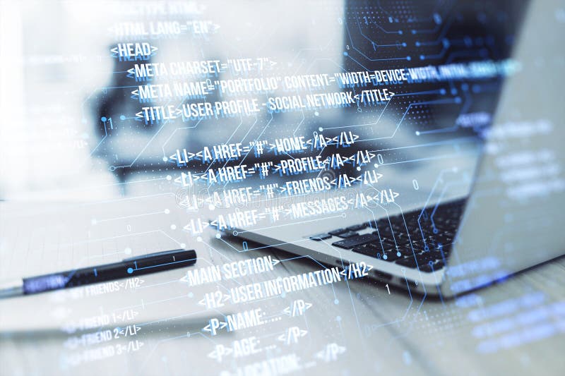 Close up of laptop on desk with pen, notepad and creative digital programming language on blurry background. Software developer stock image