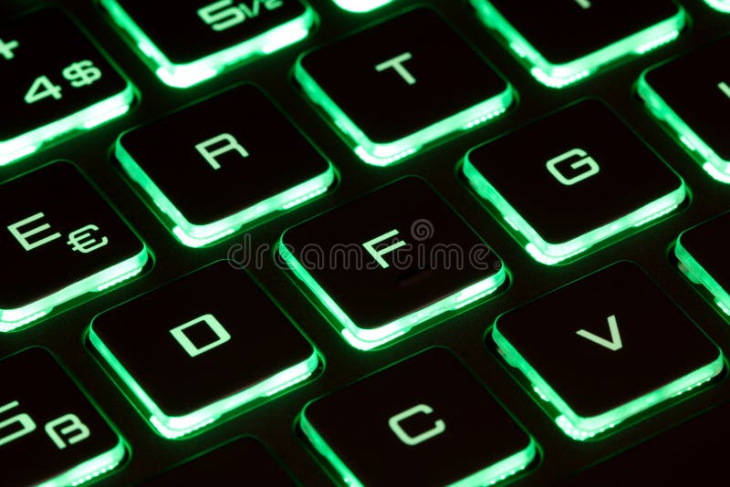 Closeup of Laptop Keyboard Illumination, Backlit Keyboard Stock Photo