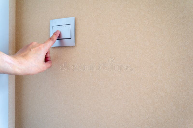 Close up left hand push the switch royalty free stock photography