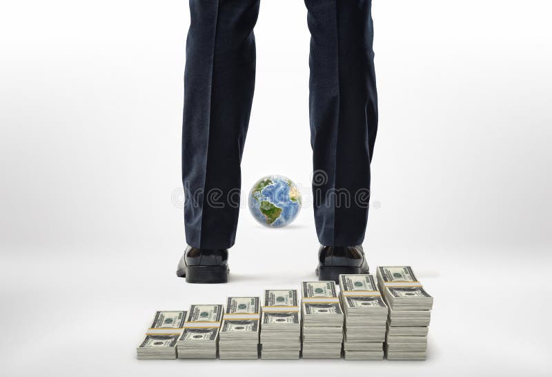 Close-up legs with packs of dollars and small globe. royalty free stock photo Close-up legs with packs of dollars and small globe. royalty free stock photo