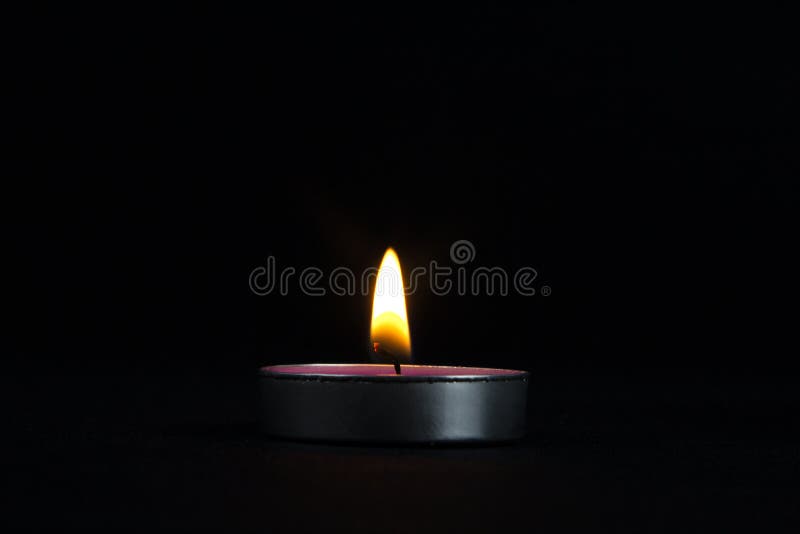 A Closeup of Lighting Candle with Yellow Flame, a Light of Candle in