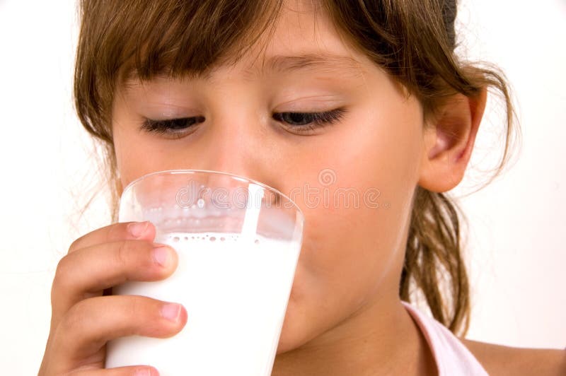 Close up of little girl drinking milk